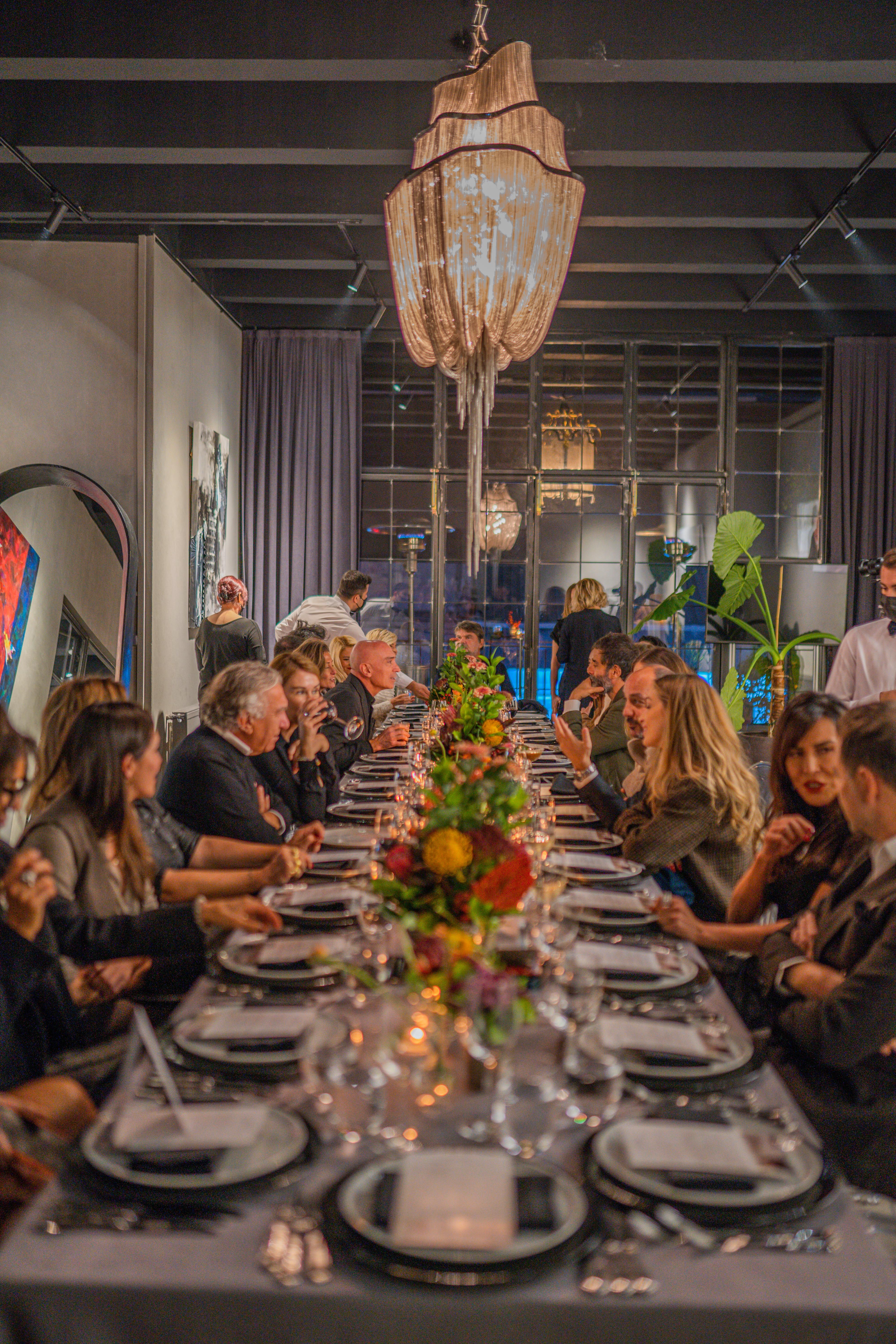 Founders and coaches sharing an intimate dinner