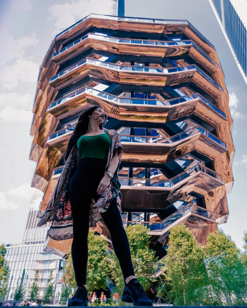 Isabella standing in front of structure in NY