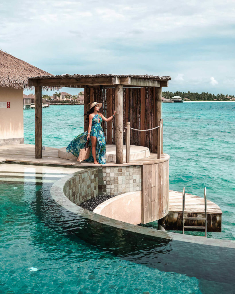 Maldives-Isabella-standing-by-water