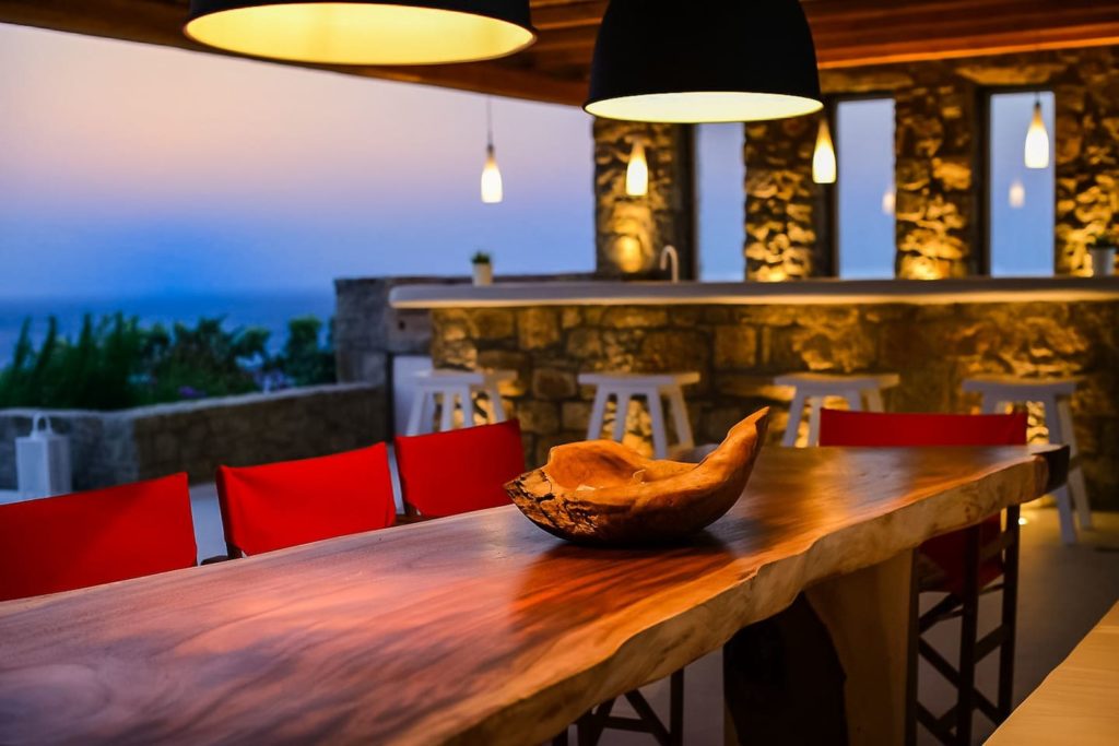 Ginger White villa, a The dining table and bar in Ginger and White villa, a luxury Airbnb in Mykonos