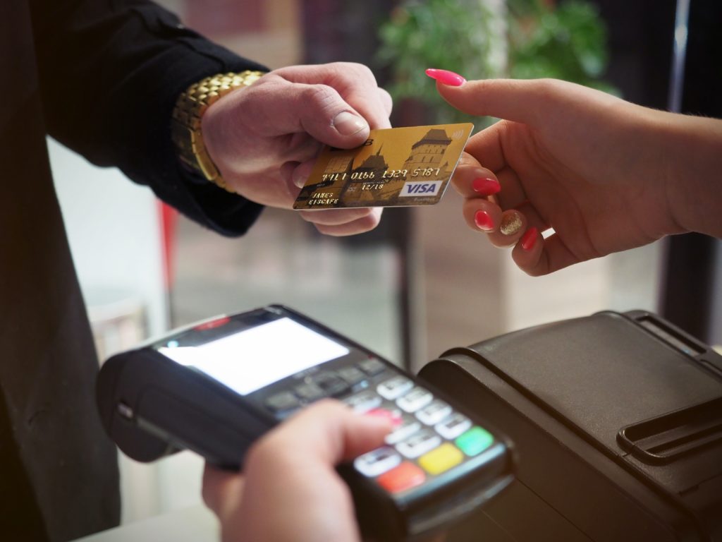 Man handing over his credit card