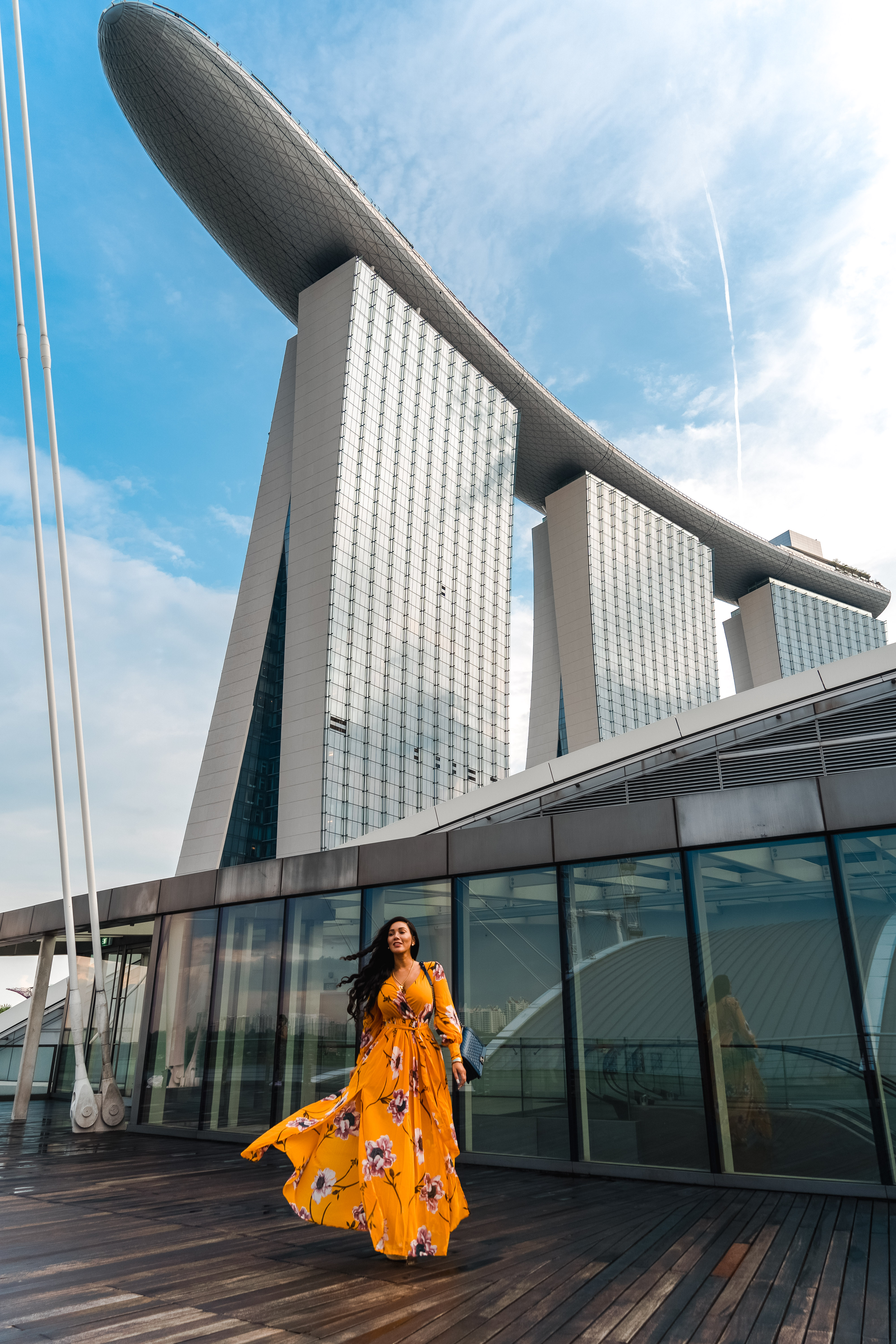 Isabella standing in front of Marina Bay Sands, Singapore