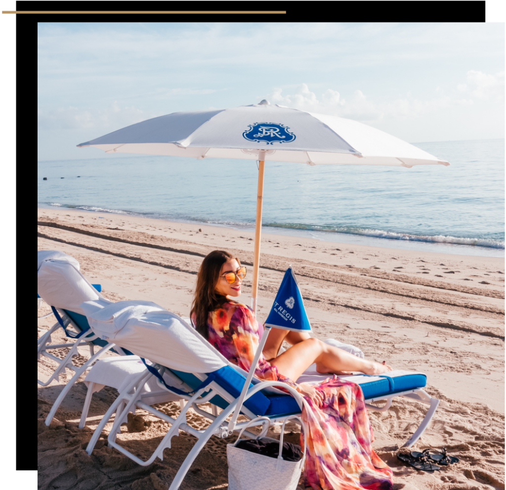 Isabella on a sun lounger on the beach at the St Regis Bal Harbour, Miami