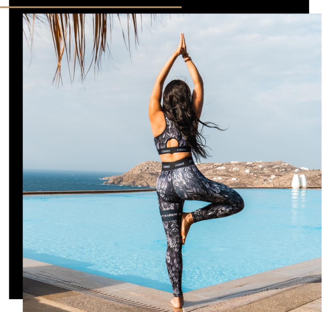 Isabella doing yoga by the pool