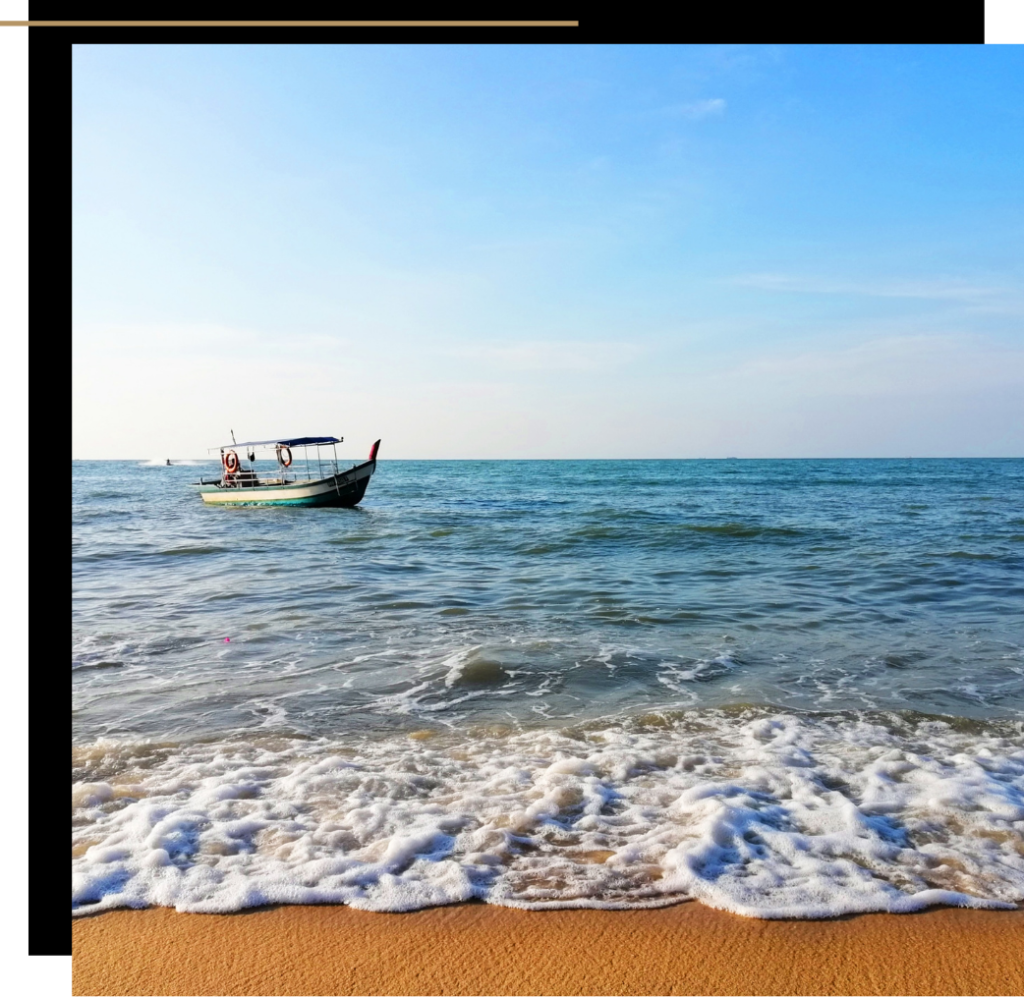 A boat out to sea on Batu Ferringhi beach, Penang