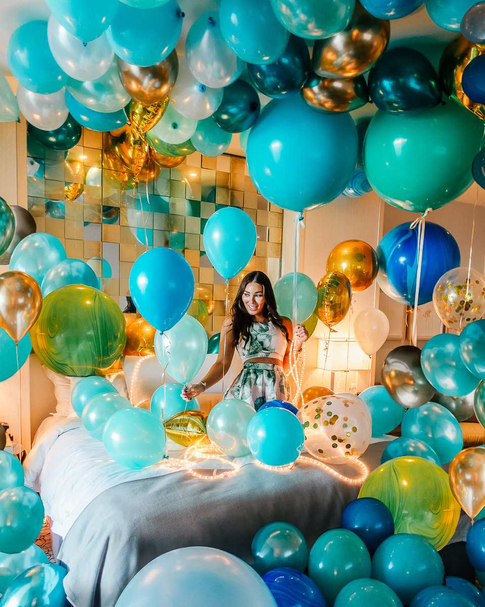 Isabella in a room at the St Regis Bal Harbour with balloons