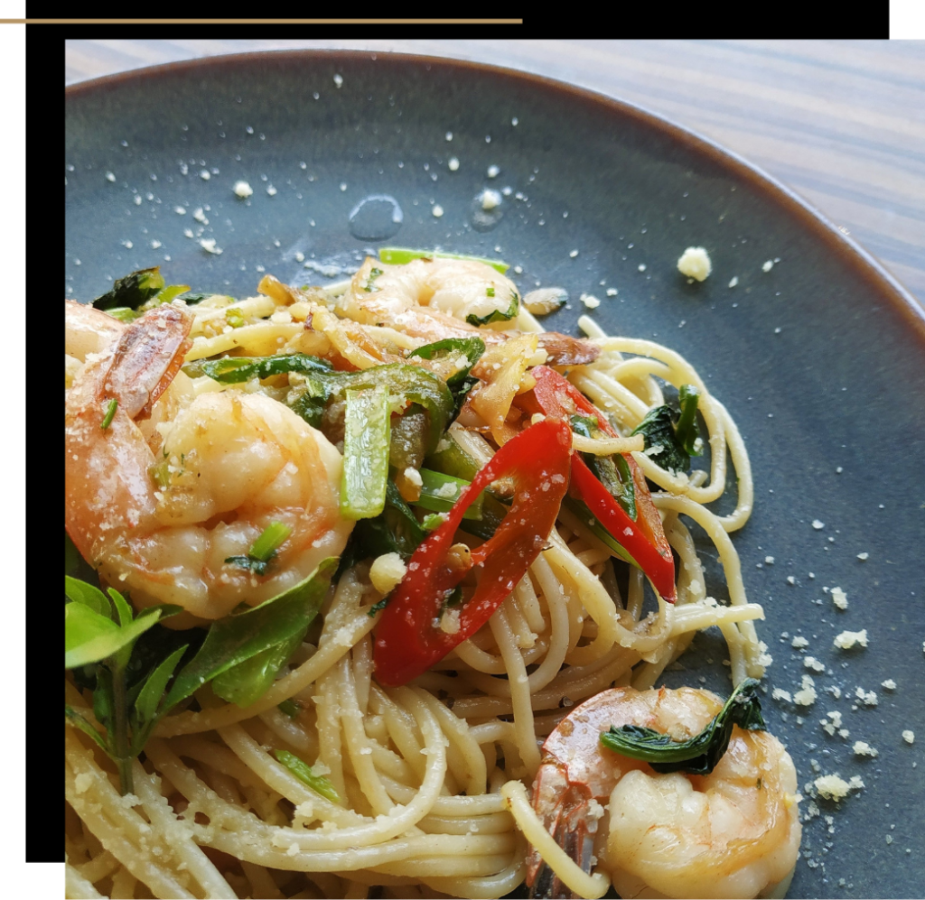 A plate of Thai noodles with prawns and chilli 