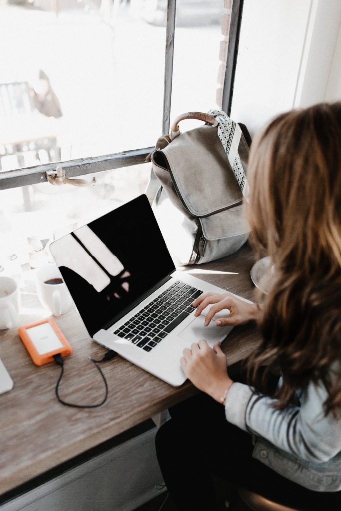 Woman and a laptop and backpack 