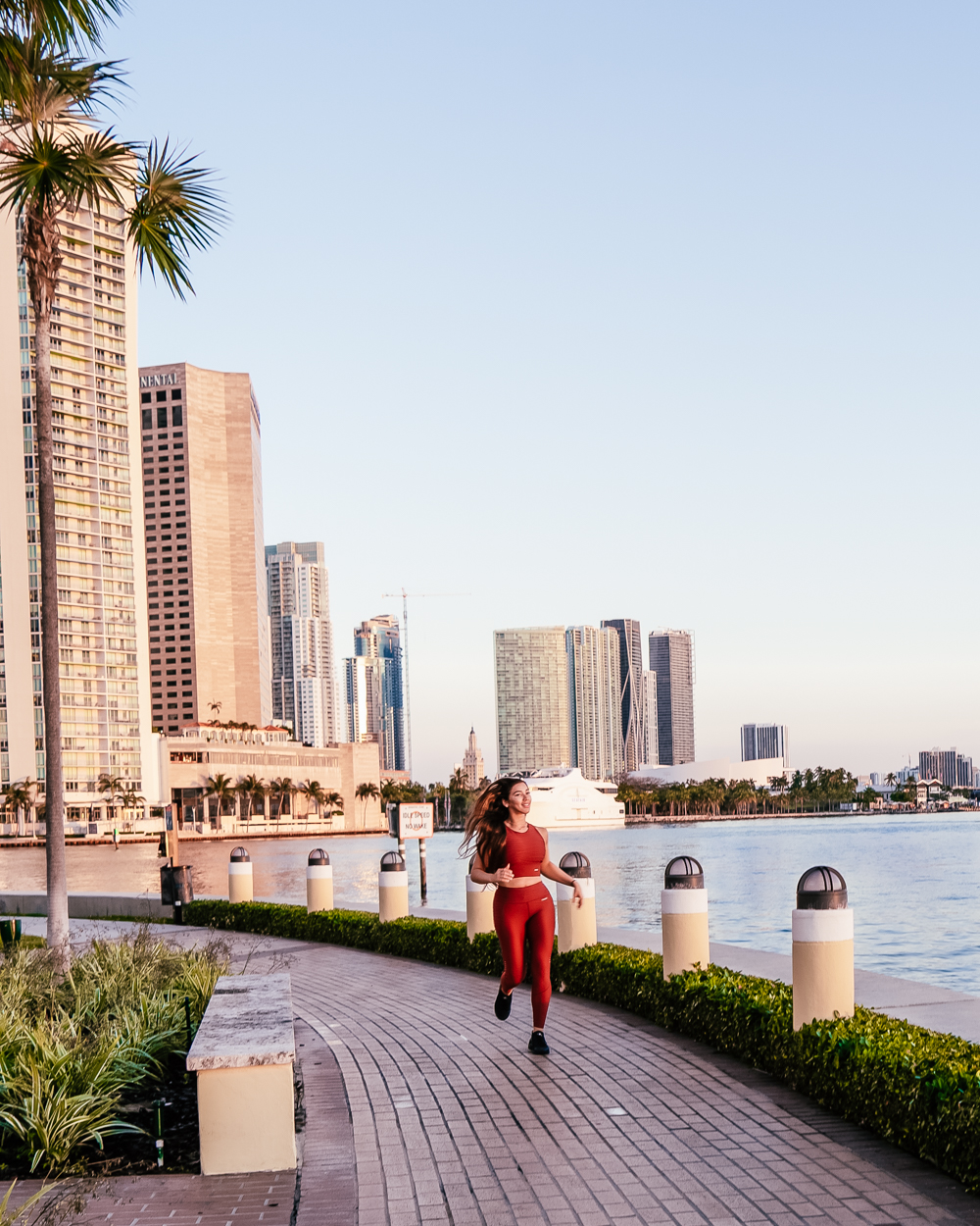 Isabella running by the water in Miami