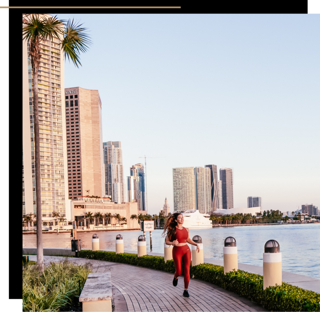 Isabella running in red activewear in Miami