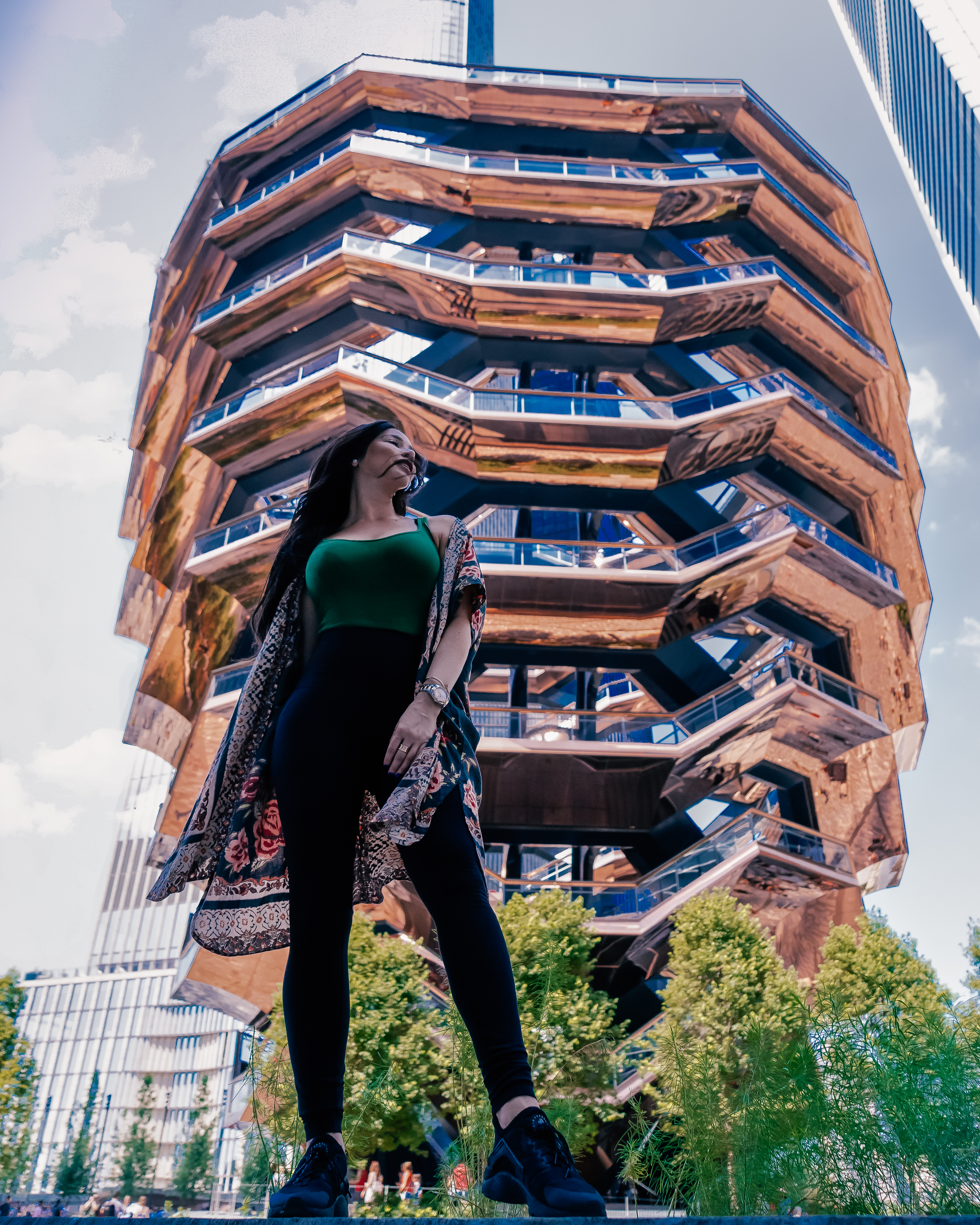 Isabella standing in front of the Vessel in New York