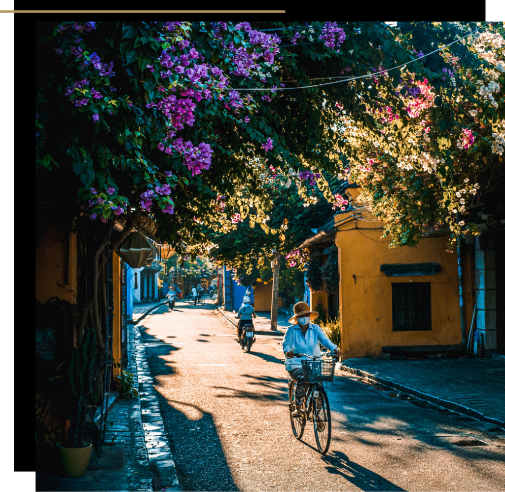 A woman on a bicycle in Hoi An, Vietnam