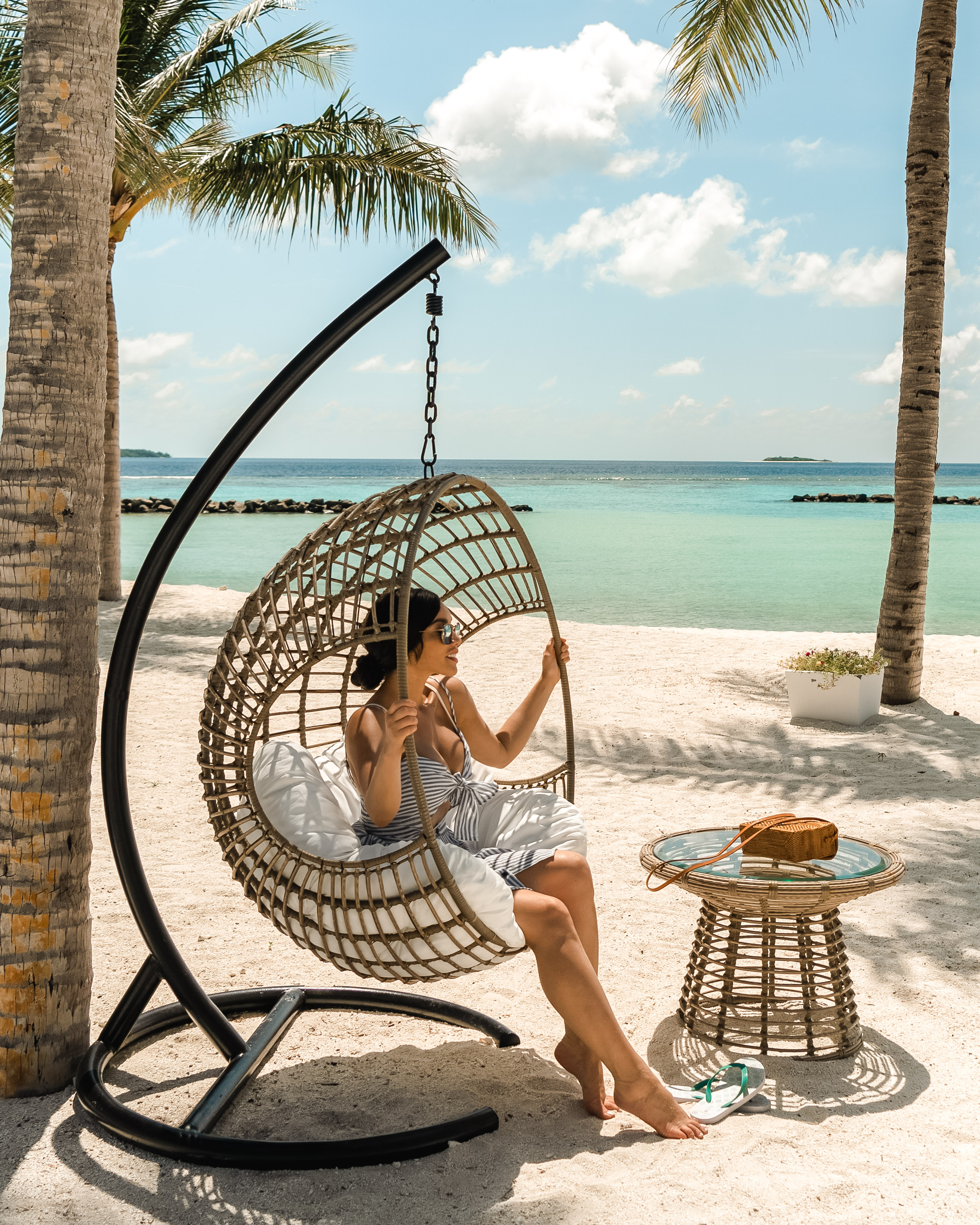 Isabella in a swing chair in The Maldives