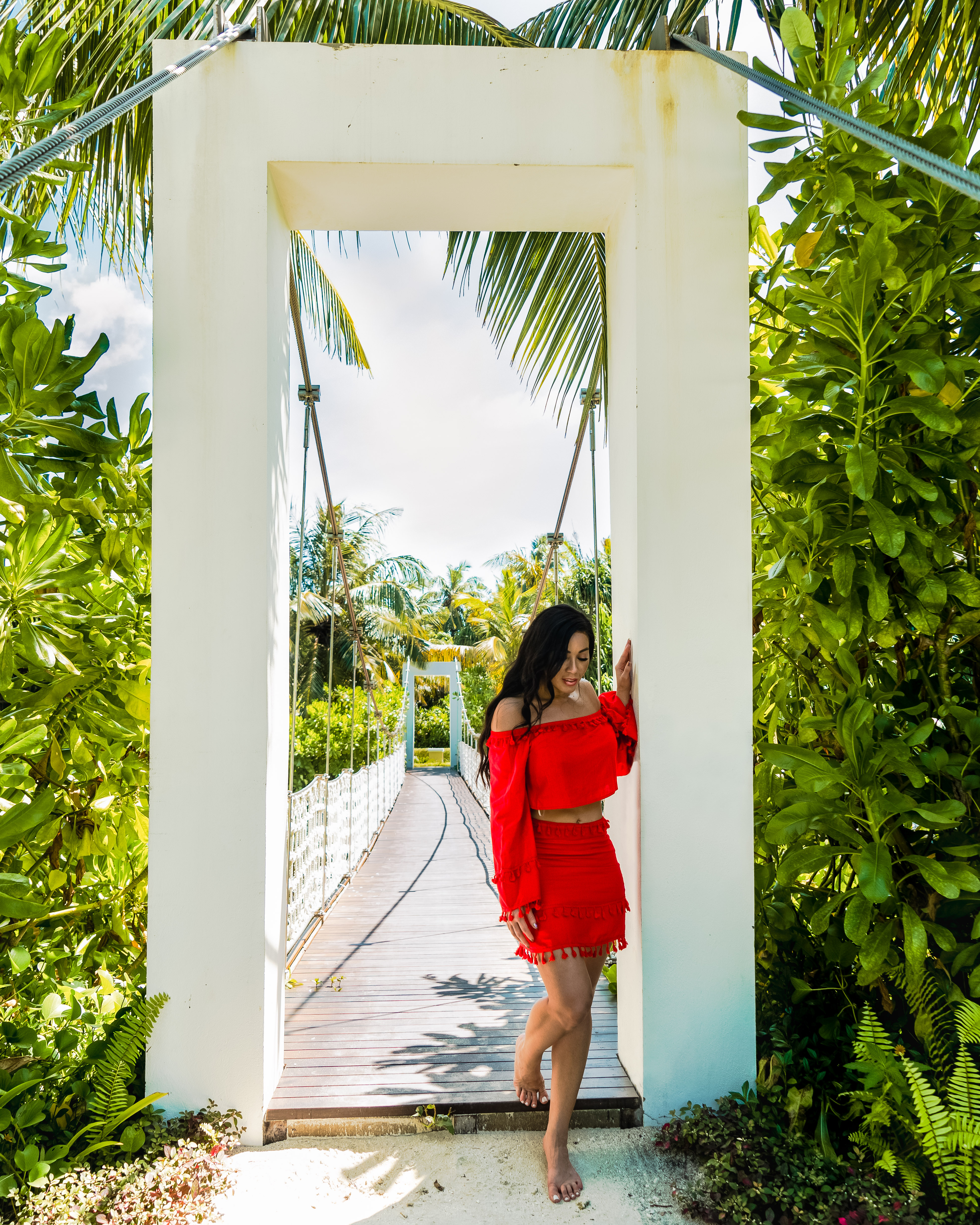 Isabella on a bridge in the forest in The Maldives