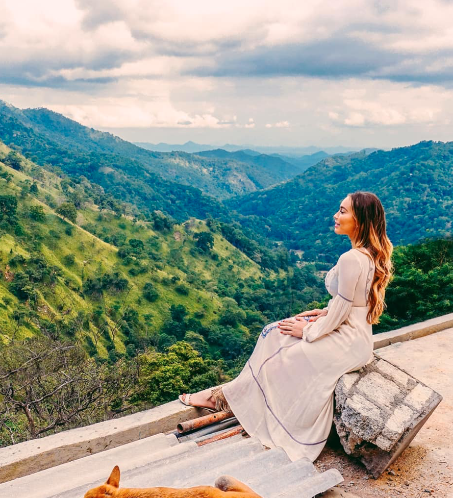 Isabella looking over green hills