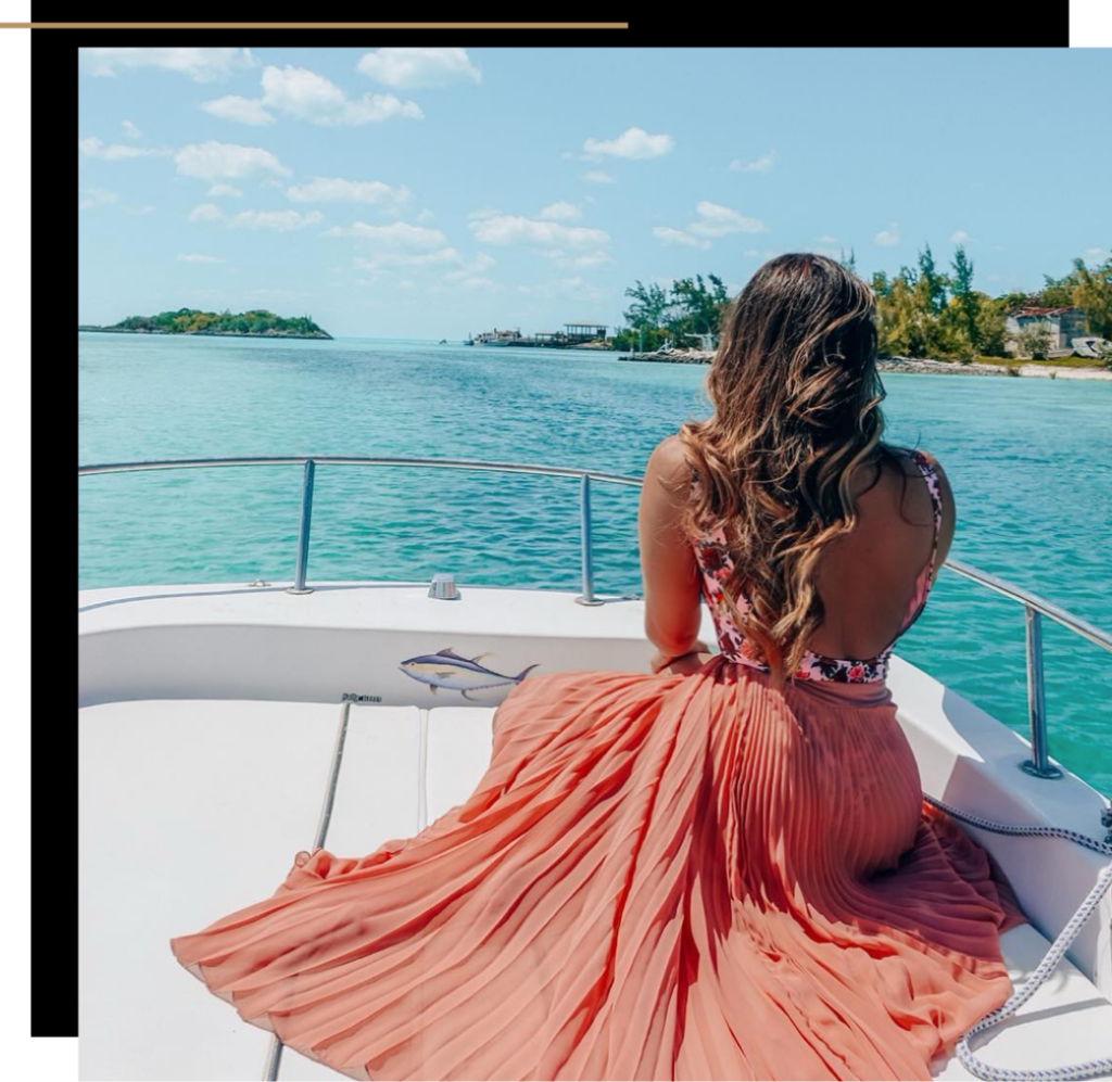 Isabella on a boat with her hair blowing in the breeze