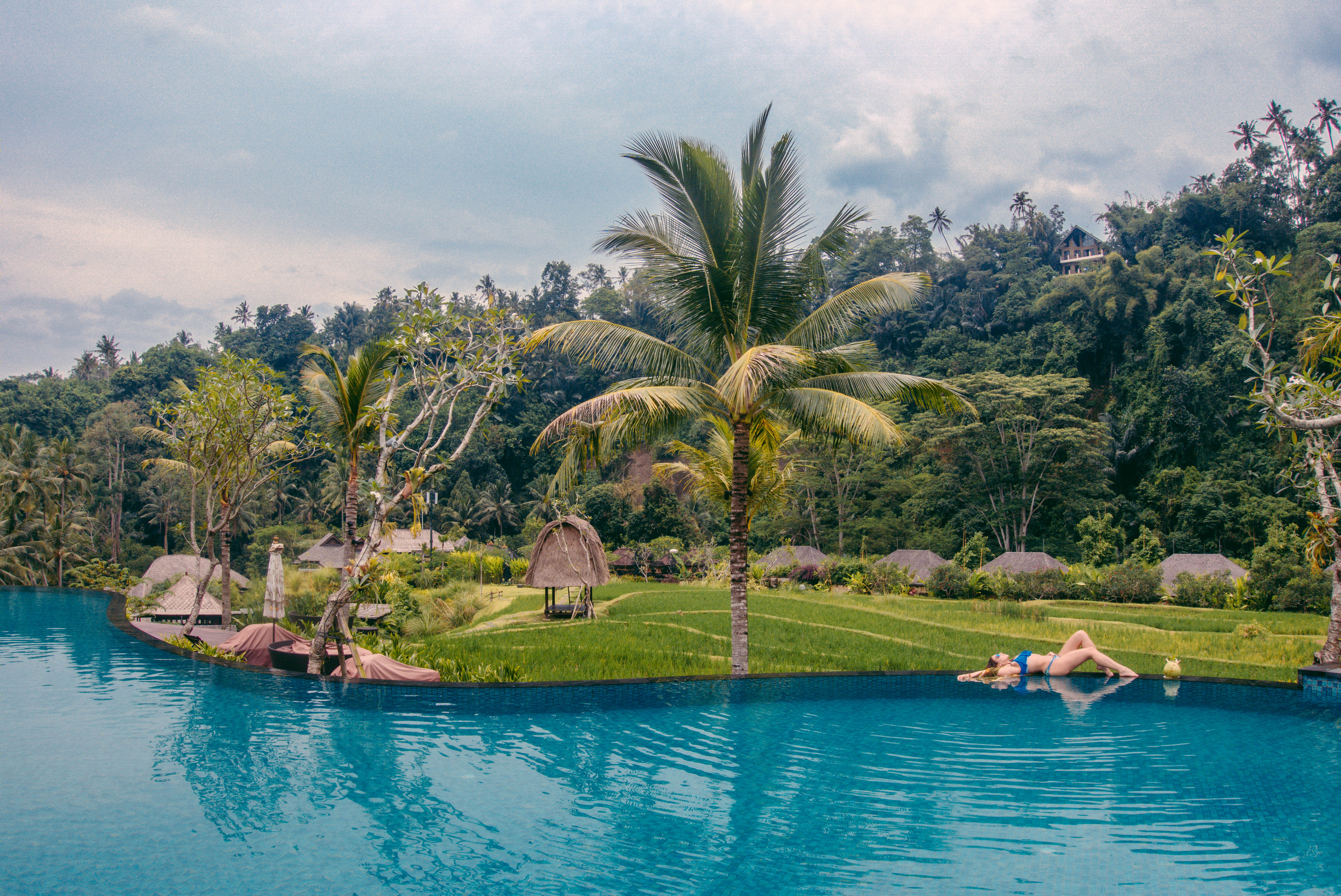 Isabella laying by the pool in Bali